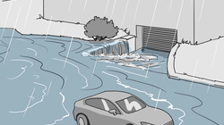 Überschwemmungssituation, wobei Wasser von der Strasse zum Gebäude zufliesst